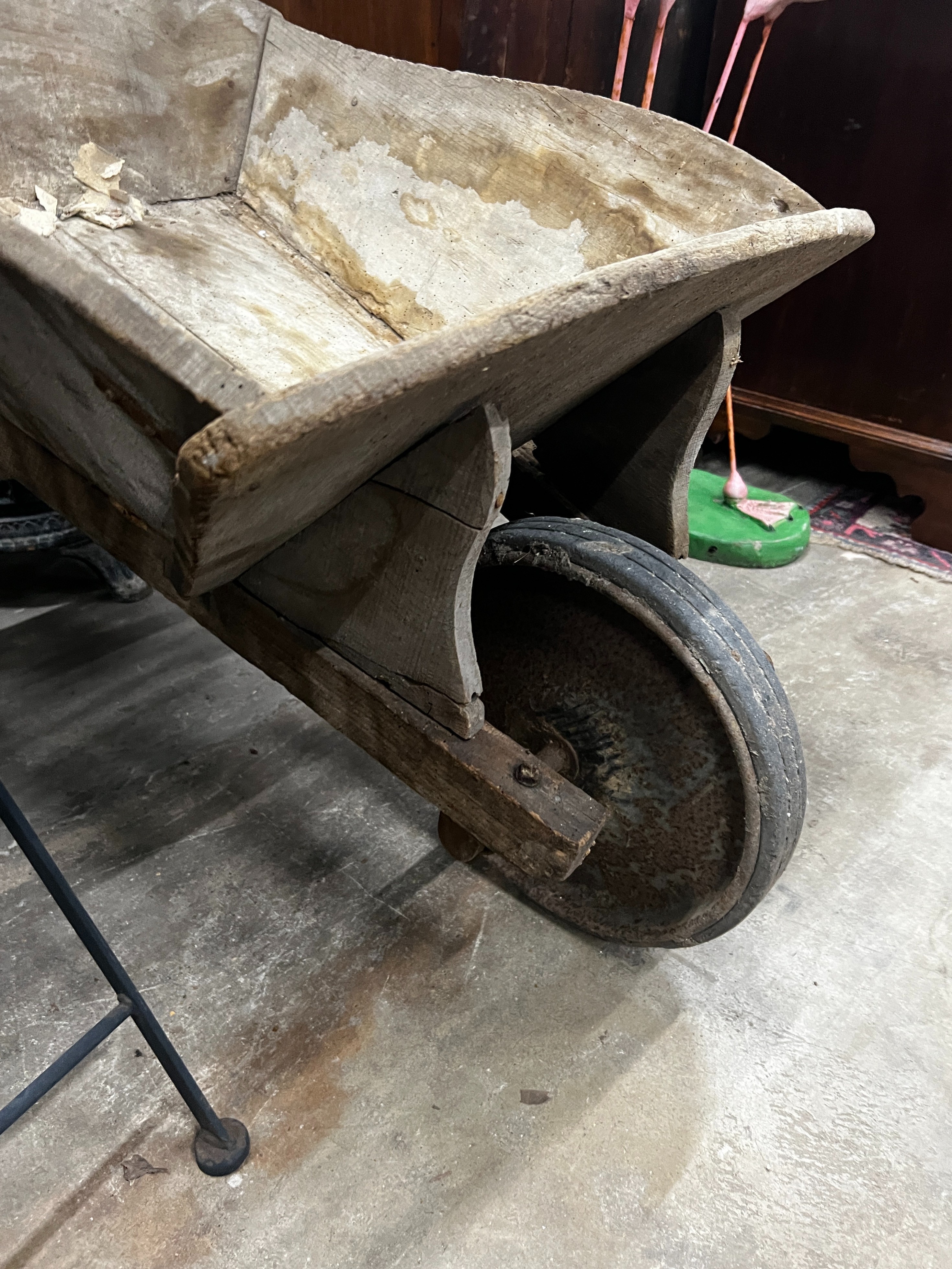 A rustic wooden wheelbarrow, width 60cm, length 110cm, height 53cm